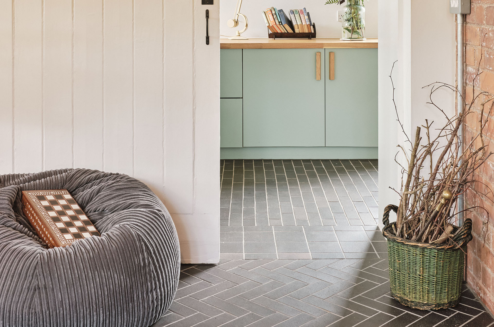 Staffs blue quarry tiles are laid in a variety of patterns at the RIBA winning Plas Hendry Stable conversion by Studio Brassica